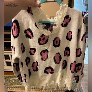 Distressed cheetah print sweater
